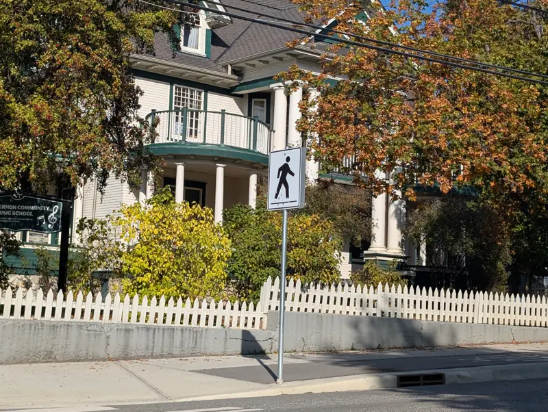 The Tuscan pillars and veranda from 32nd Avenue